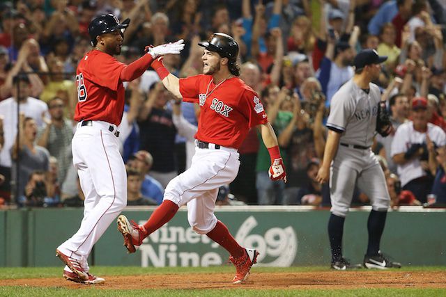 The Red Sox' Andrew Benintendi and Eduardo Nunez celebrate scoring a run against the Yankees, possibly thanks to the use of technology that Old Hoss Radbourn would not approve of.